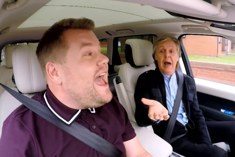 James Corden and Paul McCartney singing in a car.